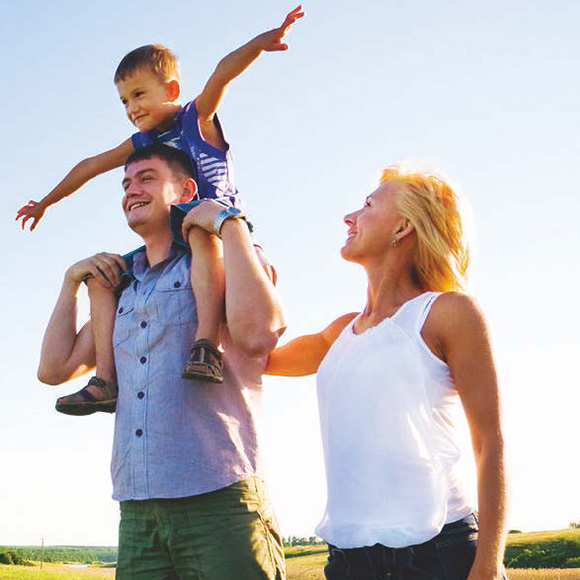 An Allercare patient enjoys time with their family outdoors after relieving their allergies